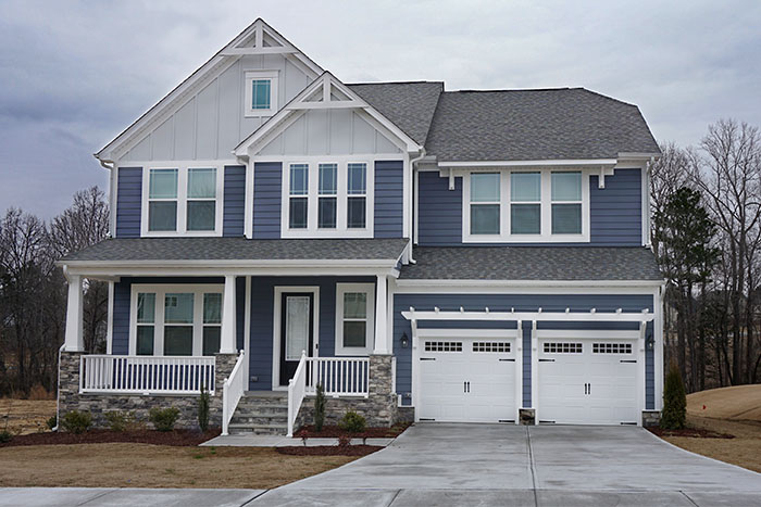 Suburban home exterior with a stone porch